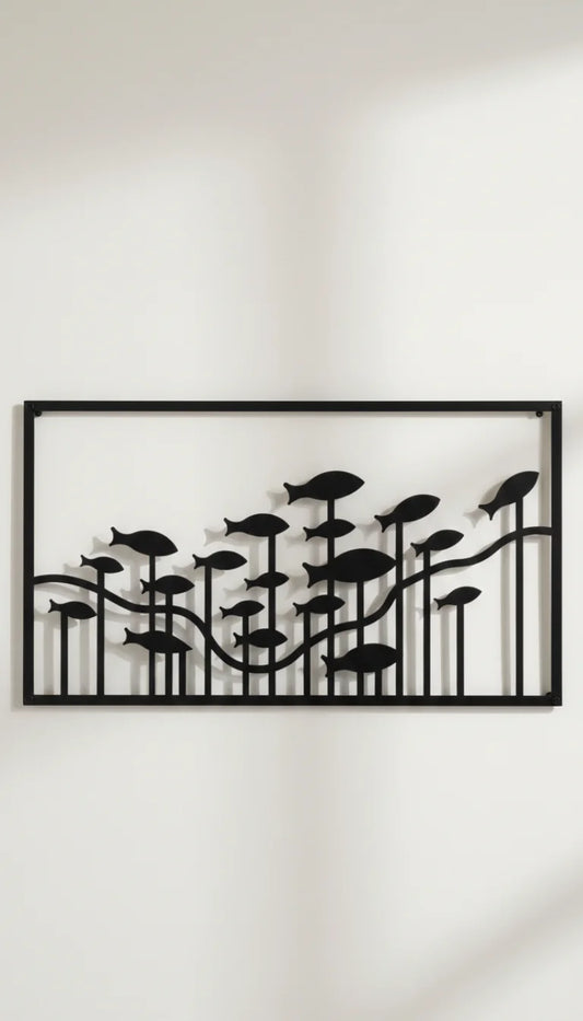 Decorative wall art with black leaf-like shapes on a white wall