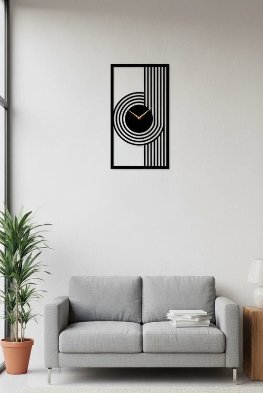 Modern living room with a gray sofa, plant, and decorative wall clock.