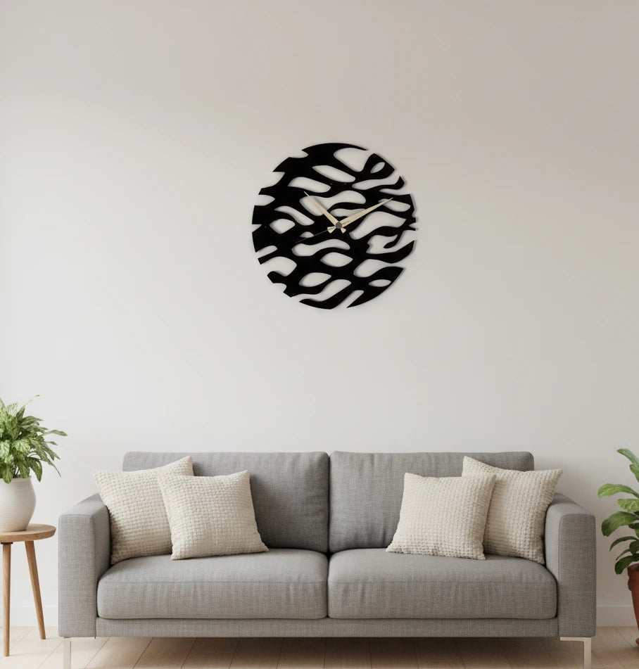 Decorative wall art on a white wall above a gray sofa with beige cushions.