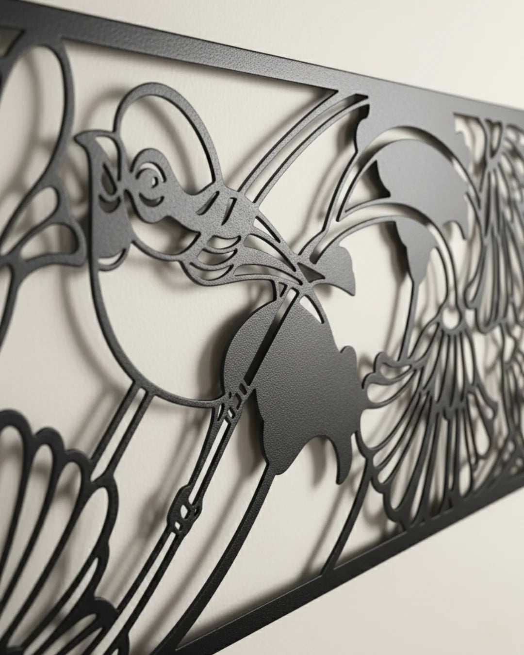 Decorative metal panel with intricate cut-out patterns on a white background