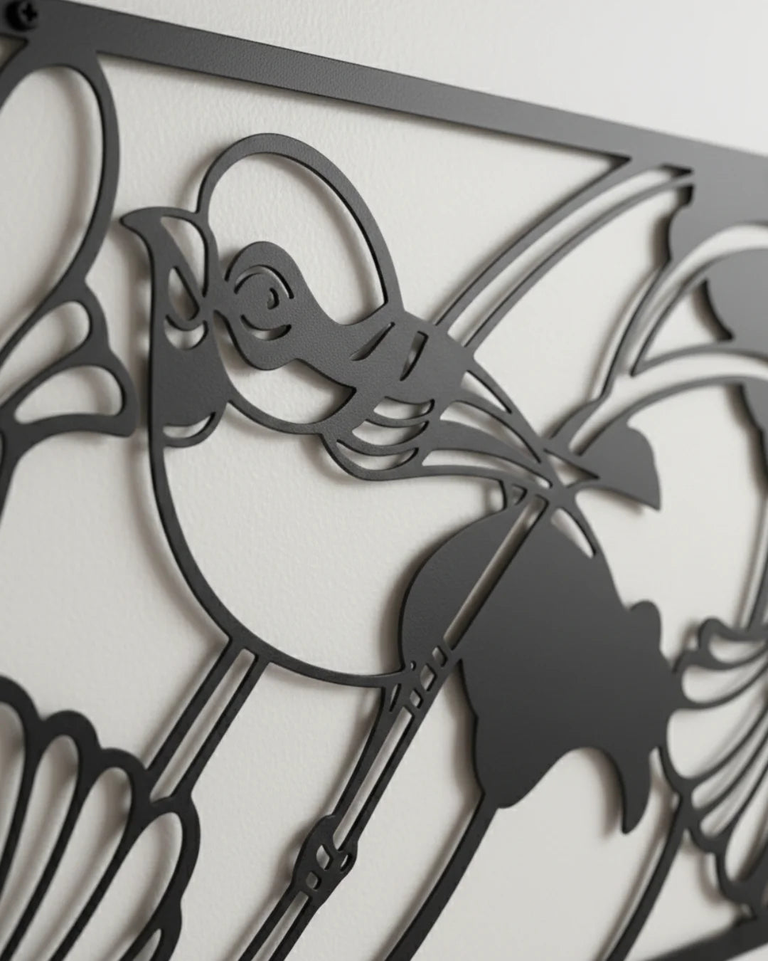 Decorative metal wall art with butterfly design on a white background