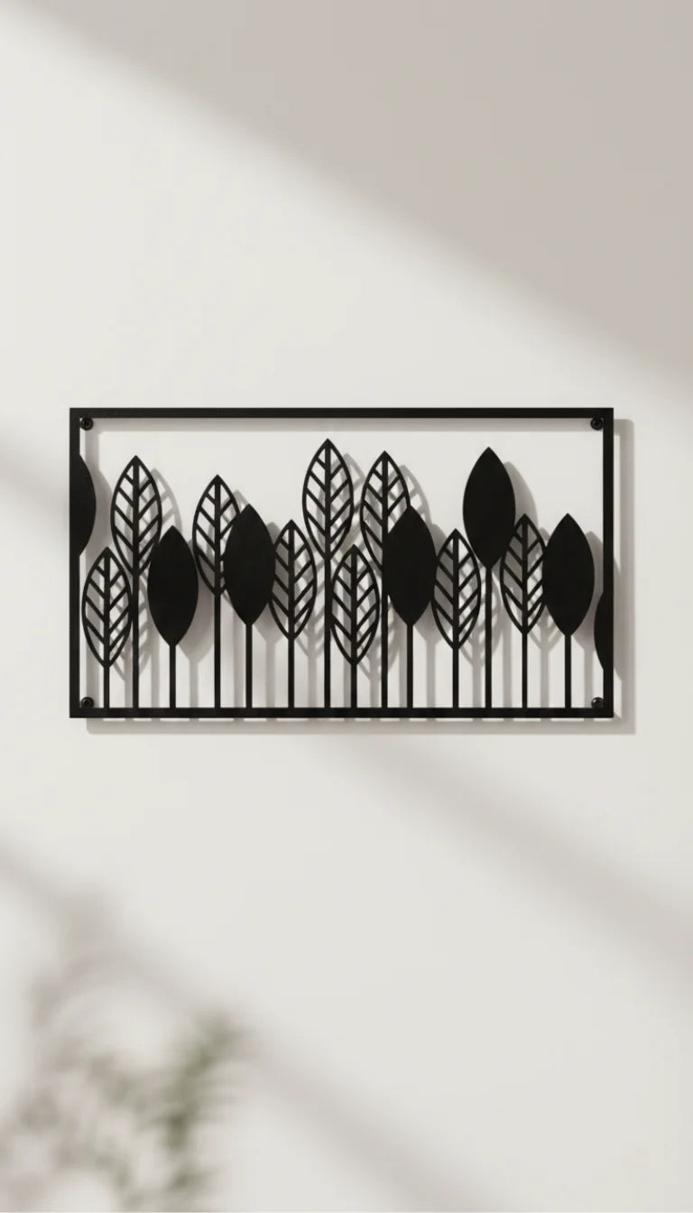 Decorative wall art with leaf pattern on a white wall