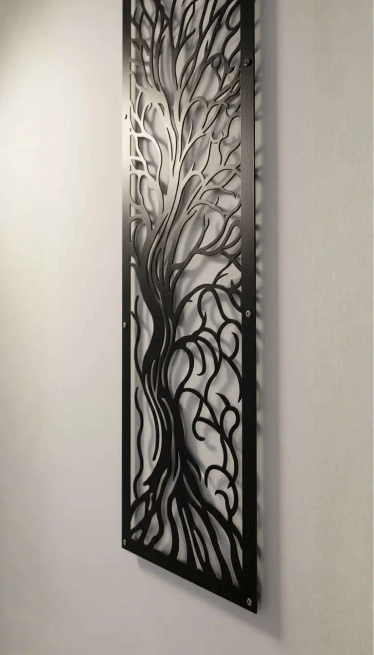 Decorative metal wall art with tree design on a plain wall