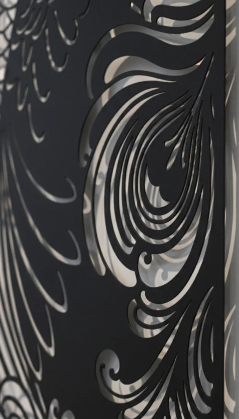 Close-up of a black and silver decorative panel with intricate patterns