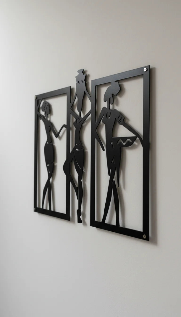 Metal wall art of abstract figures on a plain wall