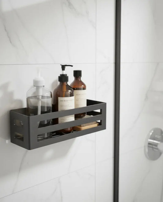 Black shower caddy with bottles on a white tiled wall