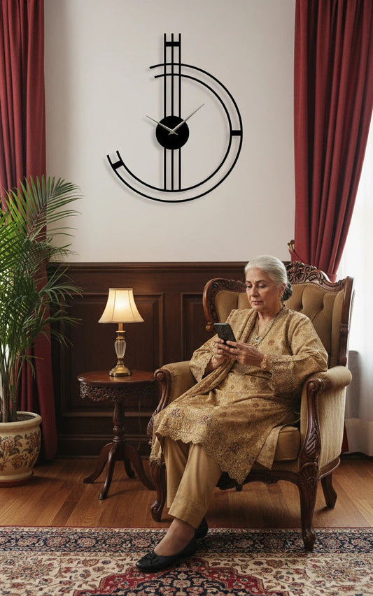 Woman sitting in a chair using a phone with a decorative wall clock above her.