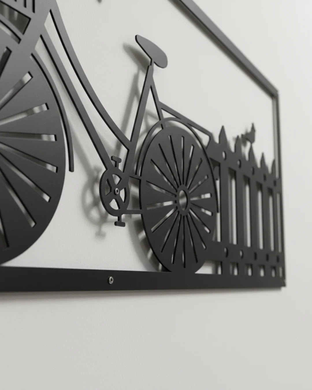 Metal wall art of a bicycle with a fence design on a white background