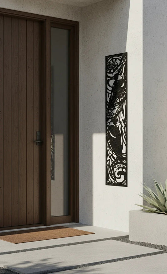 Modern entrance with a brown door, decorative metal panel, and a doormat.